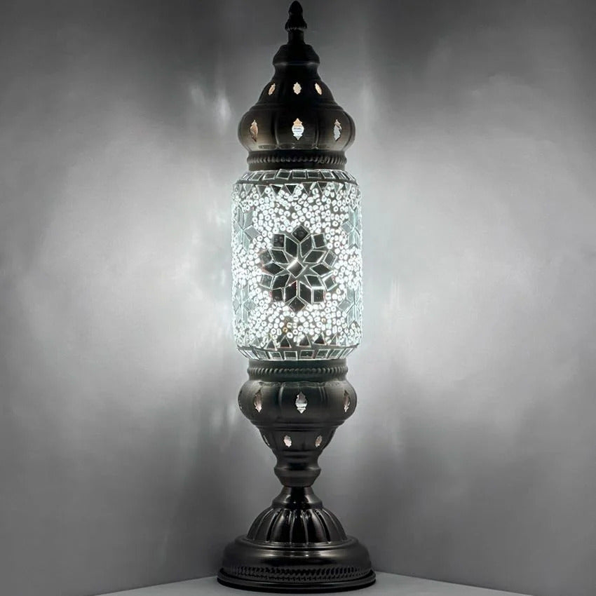 a glass jar with a light inside of it