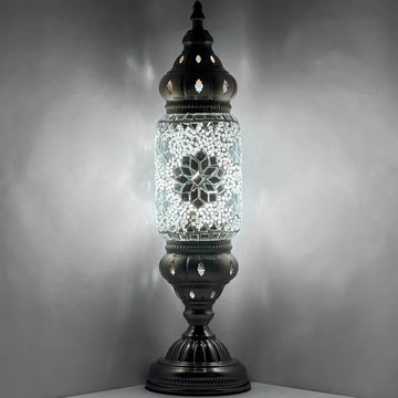 a glass jar with a light inside of it