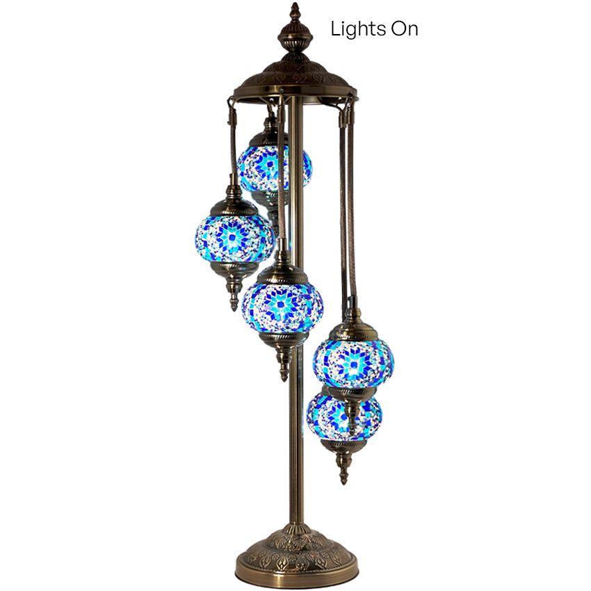 a set of five blue and white glass globes on a stand