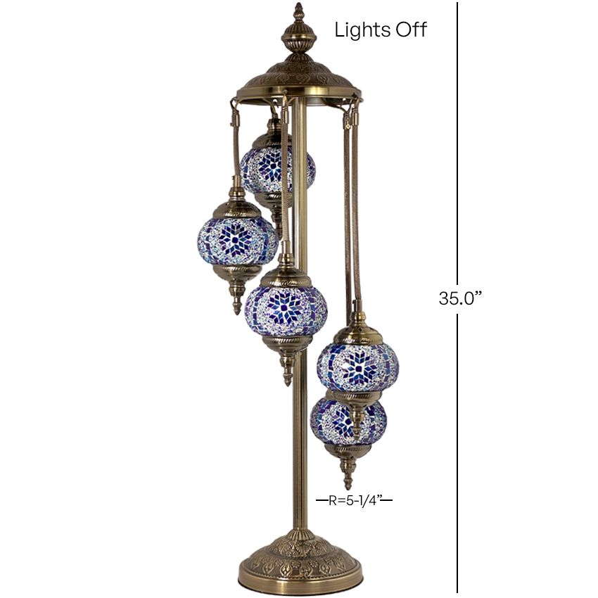 a blue and white lamp with five lights on it