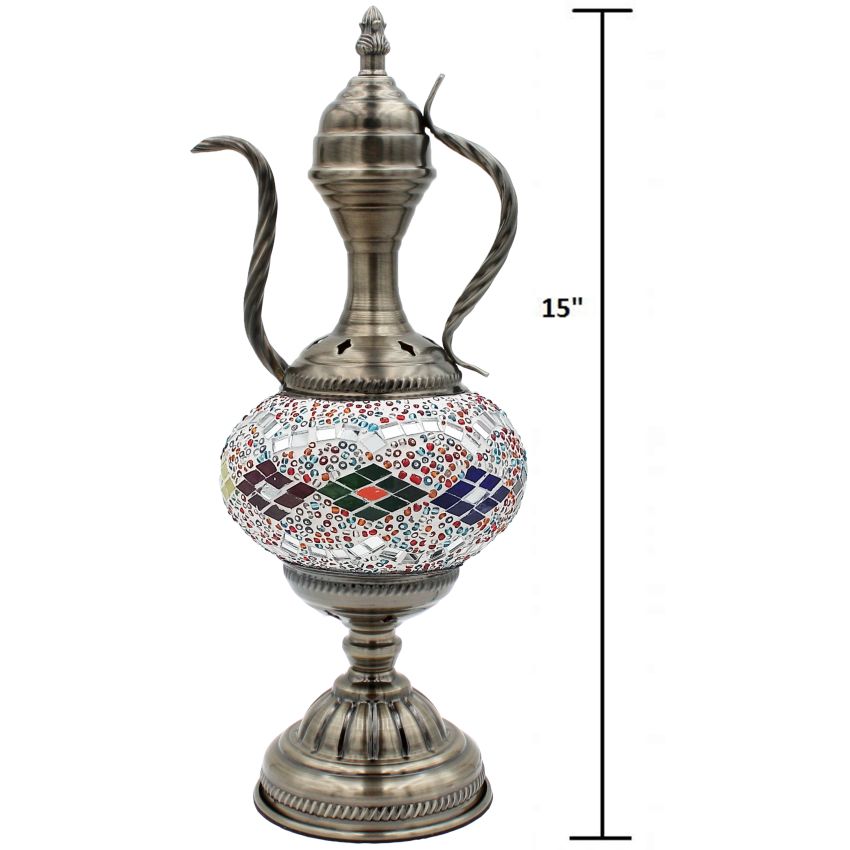 a silver vase with a mosaic design on it