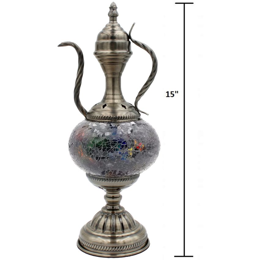 a silver vase with a glass ball inside of it