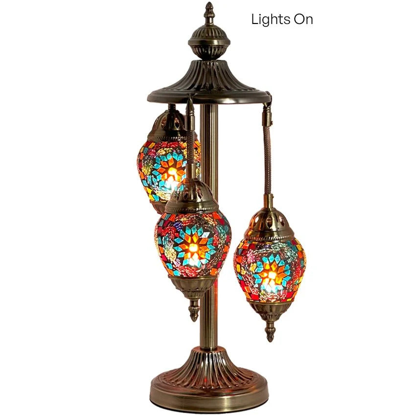 a lamp with three lights on top of it