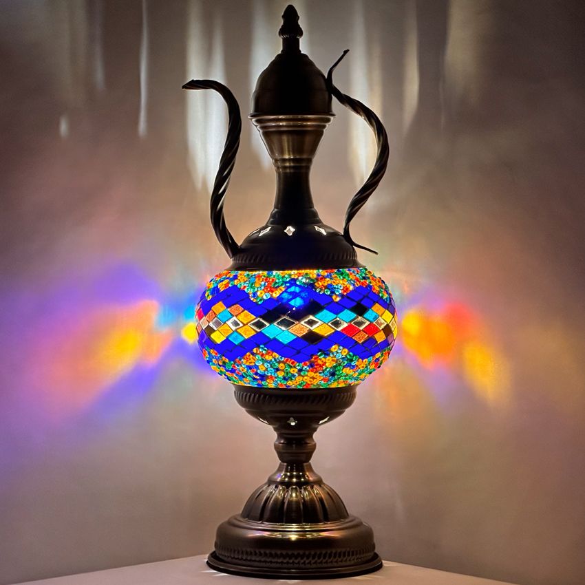 a colorful vase sitting on top of a table