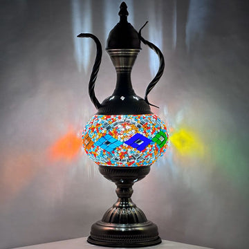 a black vase with a colorful design on it