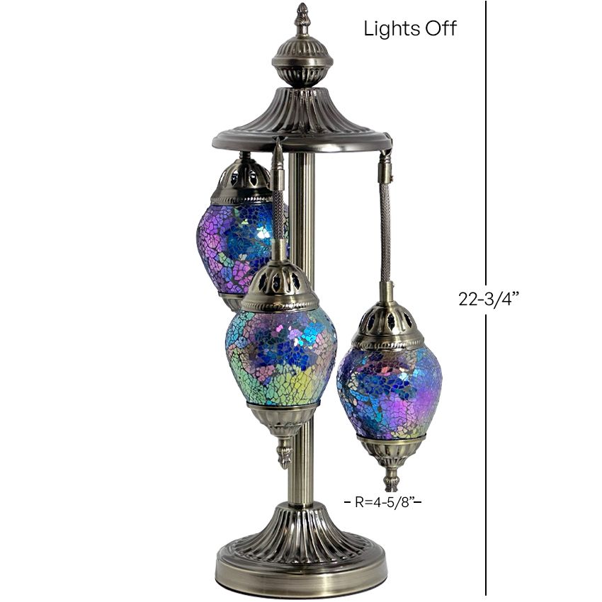 a table lamp with three colorful glass balls on it