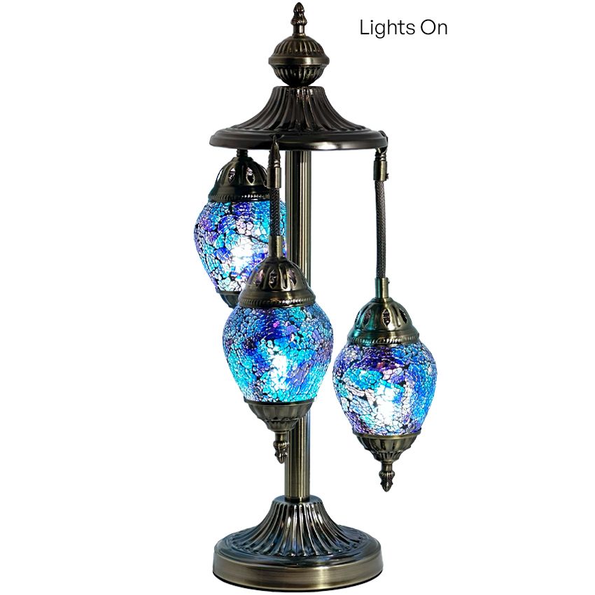 three lights on a stand with a white background