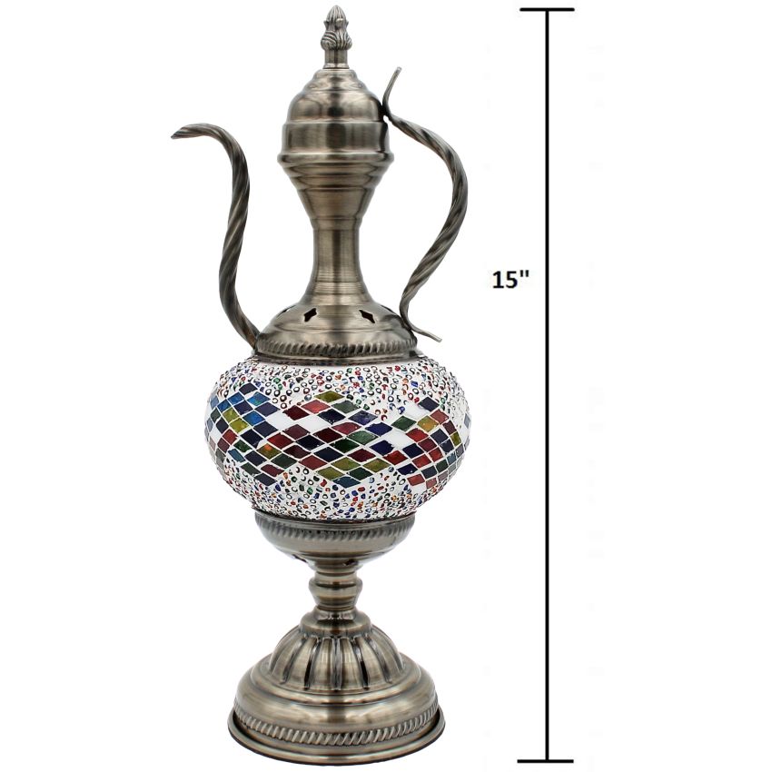 a silver vase with a mosaic design on it