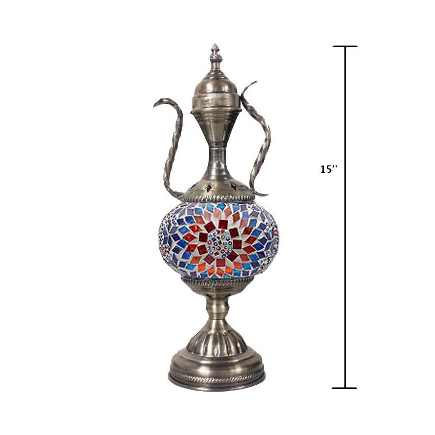 a silver vase with a mosaic design on it