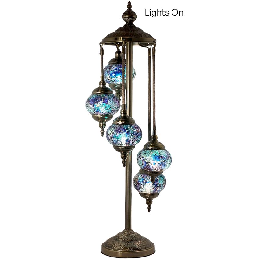 a set of four lights on top of a metal pole