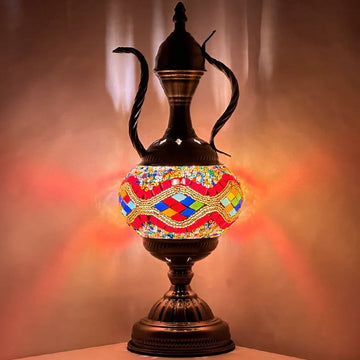 Multicolored handmade mosaic glass pitcher lamp with a teapot silhouette glowing in rainbow hand-cut tiles
