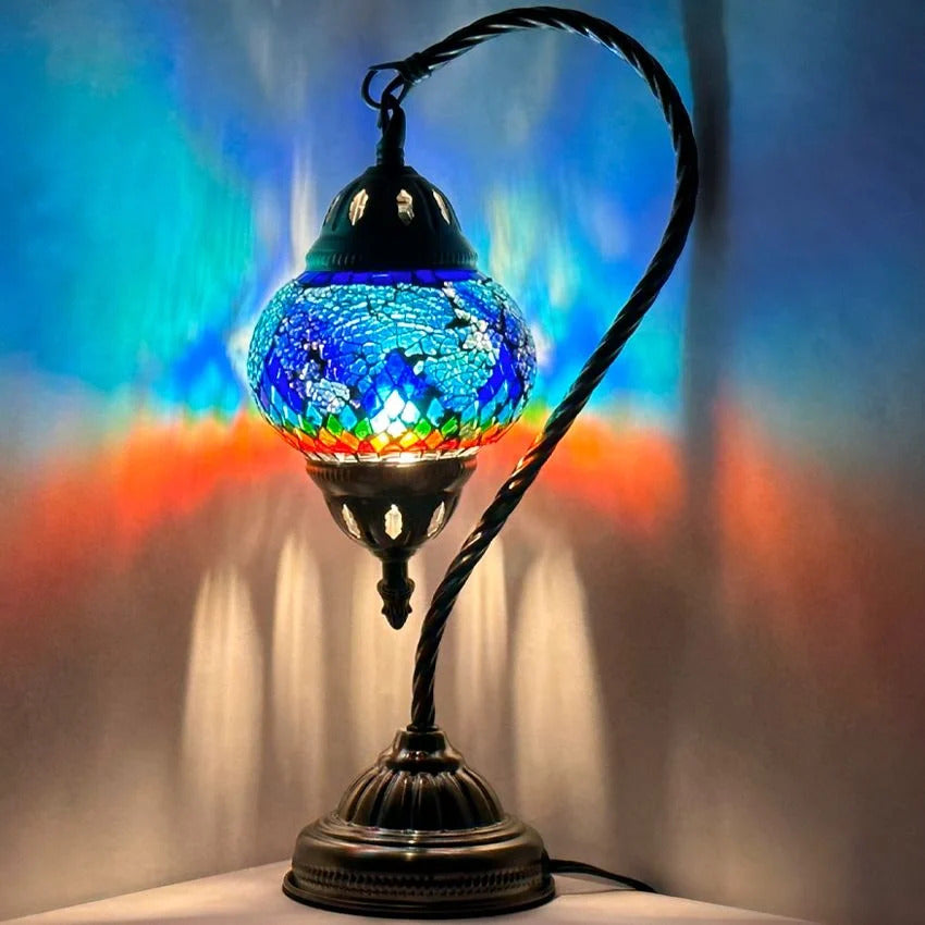 Turkish Atlantis Rainbow Lamp mosaic glass table lamp — glowing against a dark background