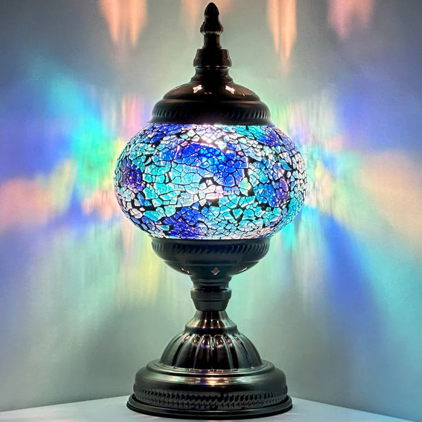 Round Mosaic Lamp with Blue Lavender Motif mosaic glass table lamp — glowing against a dark background