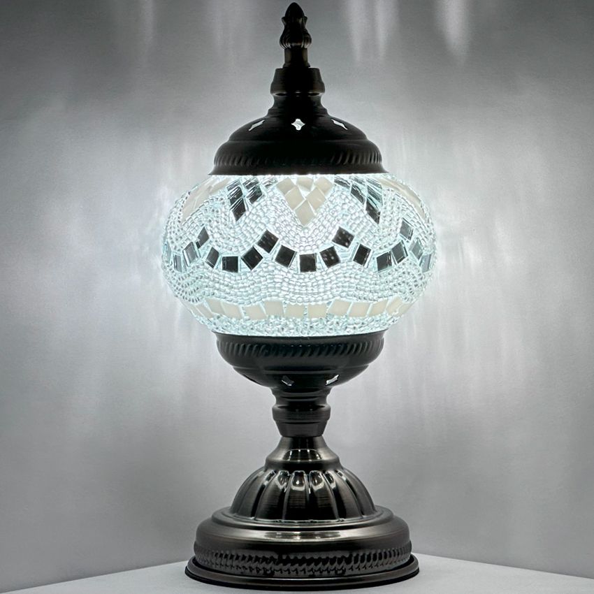 Bright Moonlight Colors mosaic glass table lamp — glowing against a dark background