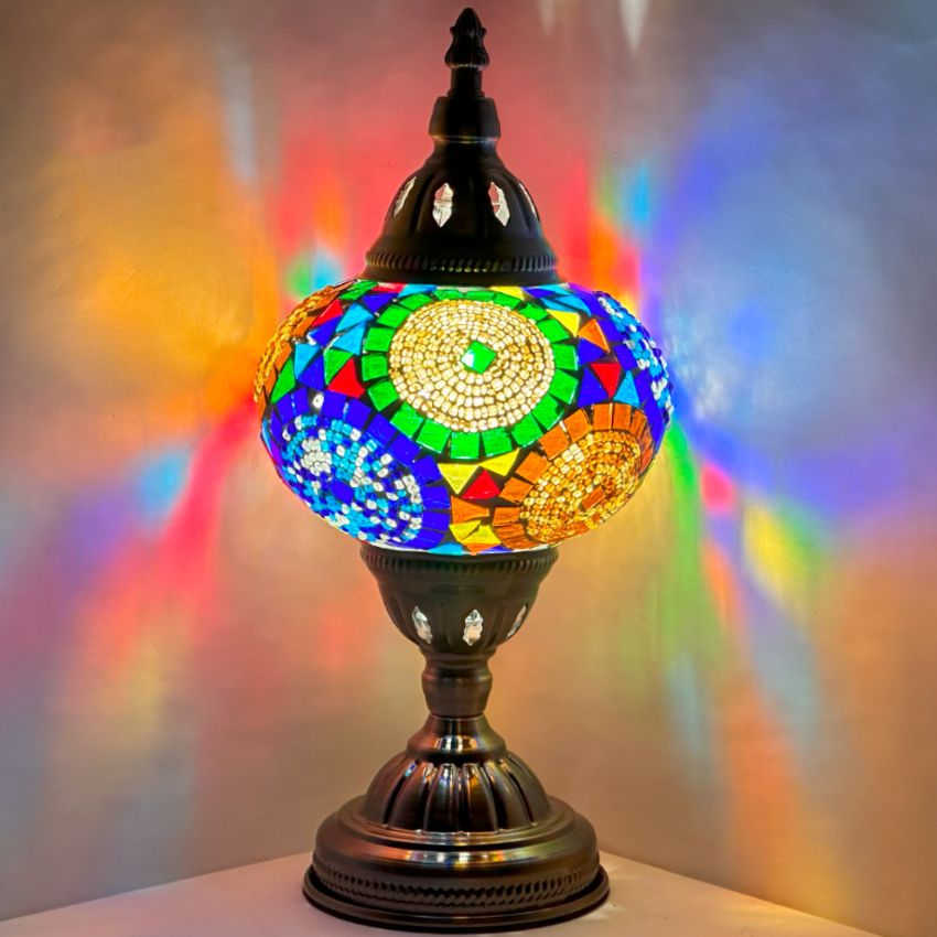 Sunflower Symphony mosaic glass table lamp — glowing against a dark background