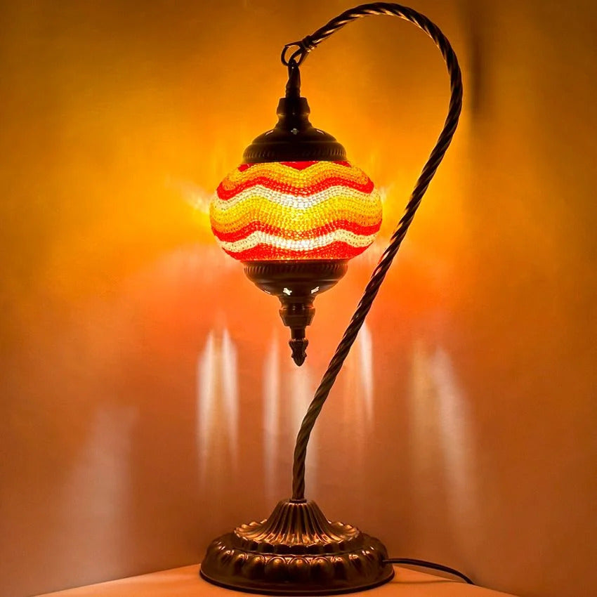 Citrus Radiance mosaic glass table lamp — glowing against a dark background