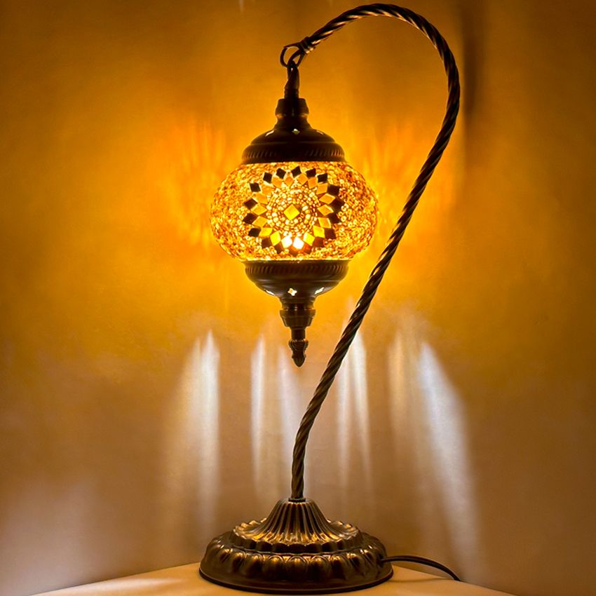Soothing Orange Blossom Swan Neck Handmade Mosaic Bedside Lamp mosaic glass table lamp — glowing against a dark background