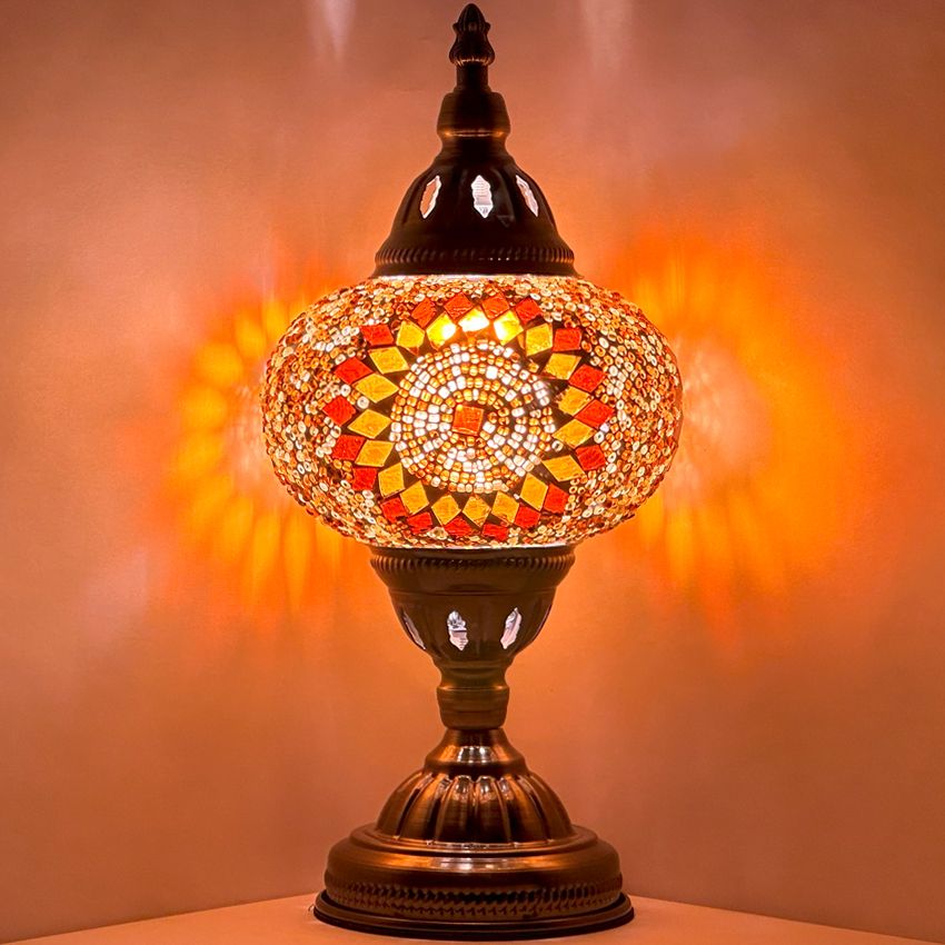 Retro Elegance mosaic glass table lamp — glowing against a dark background