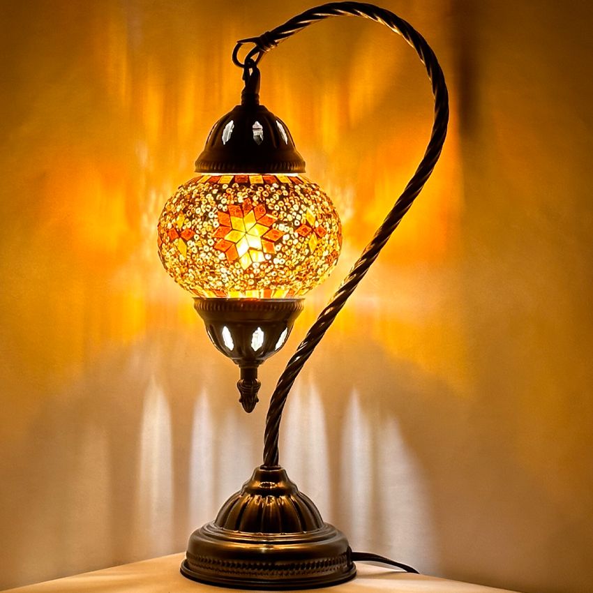 Sunset Glow mosaic glass table lamp — glowing against a dark background
