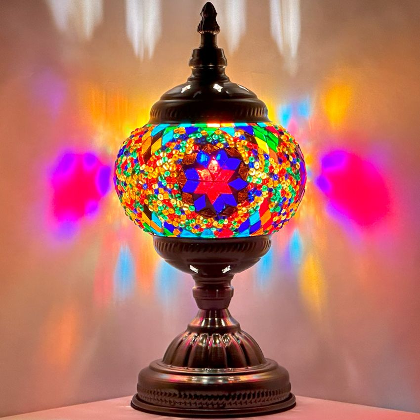 Purple Aurora mosaic glass table lamp — glowing against a dark background