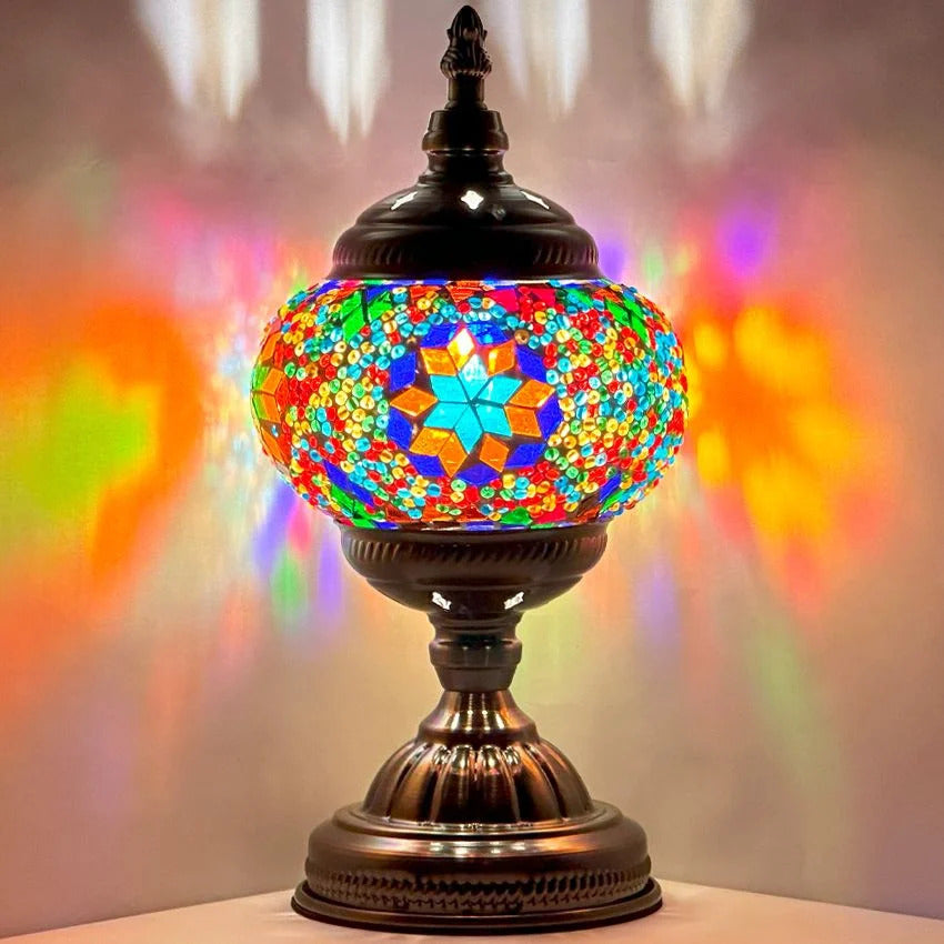 Retro Rainbow mosaic glass table lamp — glowing against a dark background