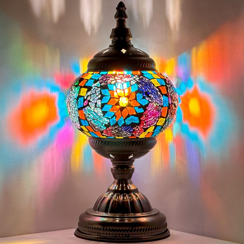 Azure Rainbow mosaic glass table lamp — glowing against a dark background