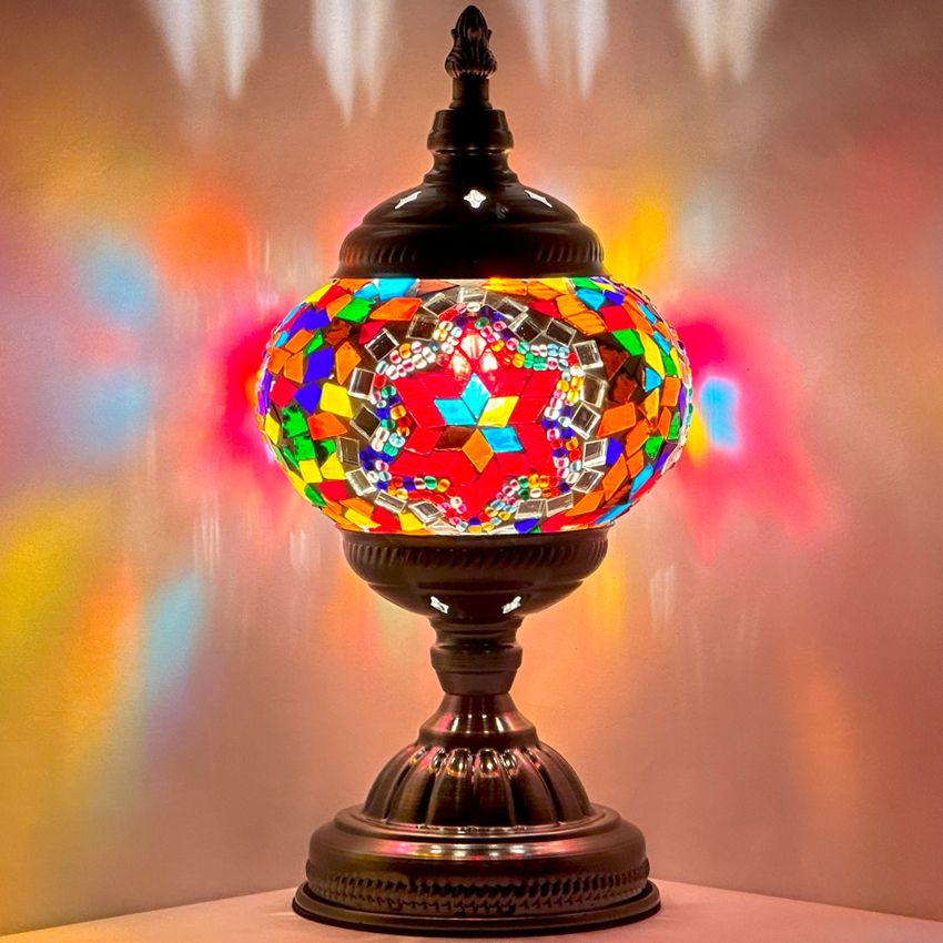 Crimson Cascade mosaic glass table lamp — glowing against a dark background