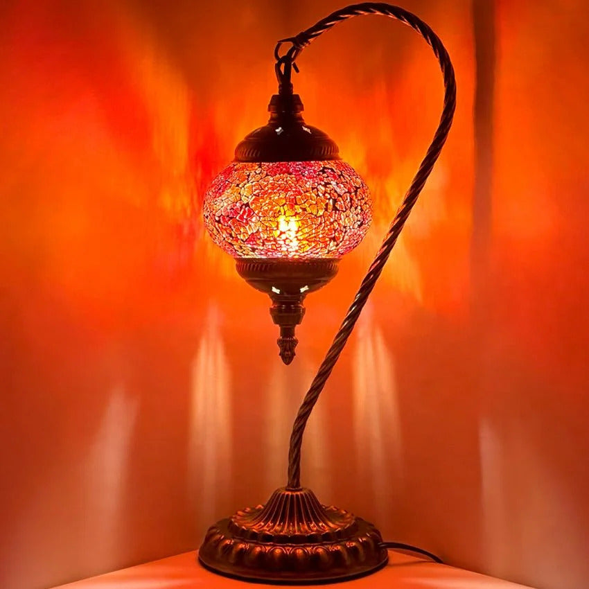Fiery Grace mosaic glass table lamp — glowing against a dark background