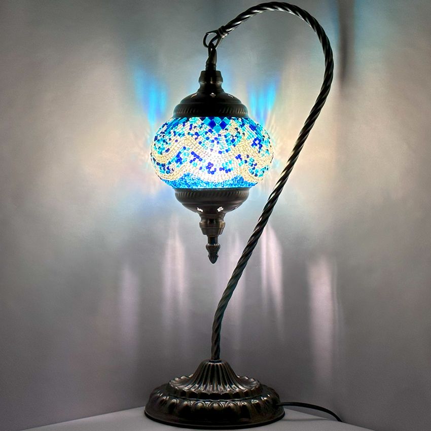 Azure Serenity mosaic glass table lamp — glowing against a dark background