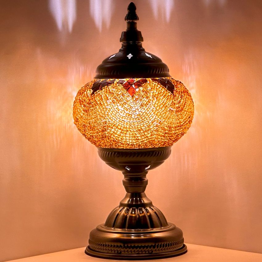Desert Mirage mosaic glass table lamp — glowing against a dark background