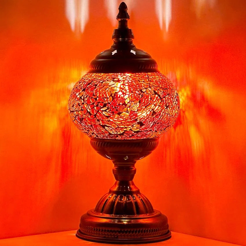 Ruby Radiance mosaic glass table lamp — glowing against a dark background