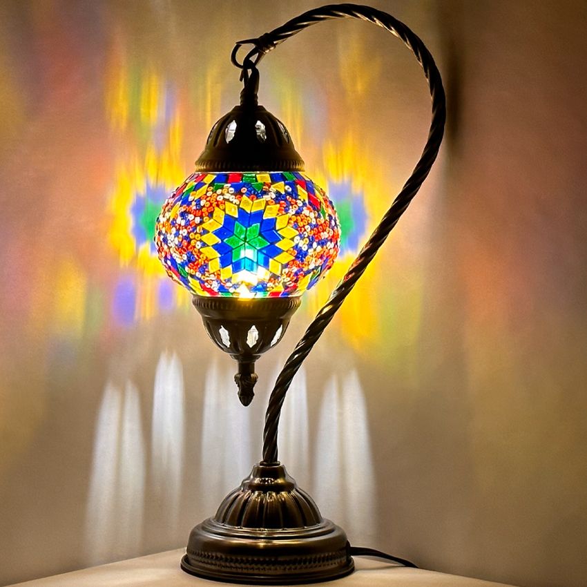 Sunbeam Glow mosaic glass table lamp — glowing against a dark background