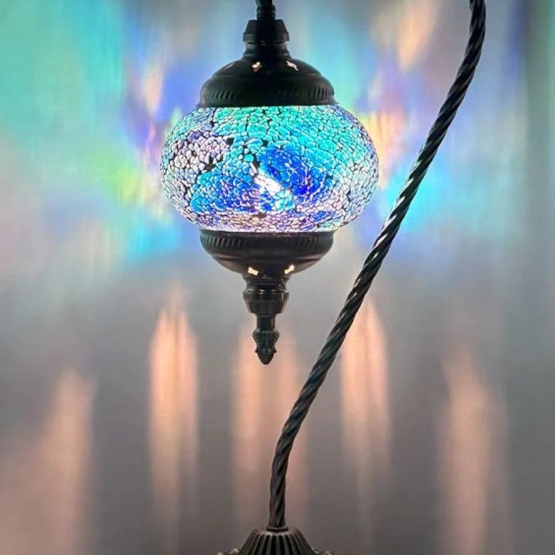 Azure Serenity mosaic glass table lamp — glowing against a deep charcoal background