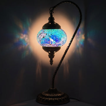 Azure Serenity mosaic glass table lamp — glowing against a deep charcoal background