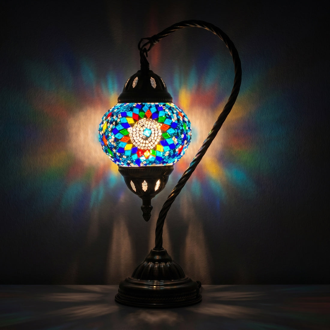 Blue Flower Turkish Style Lamps with Swan Neck Design mosaic glass table lamp — glowing against a deep charcoal background