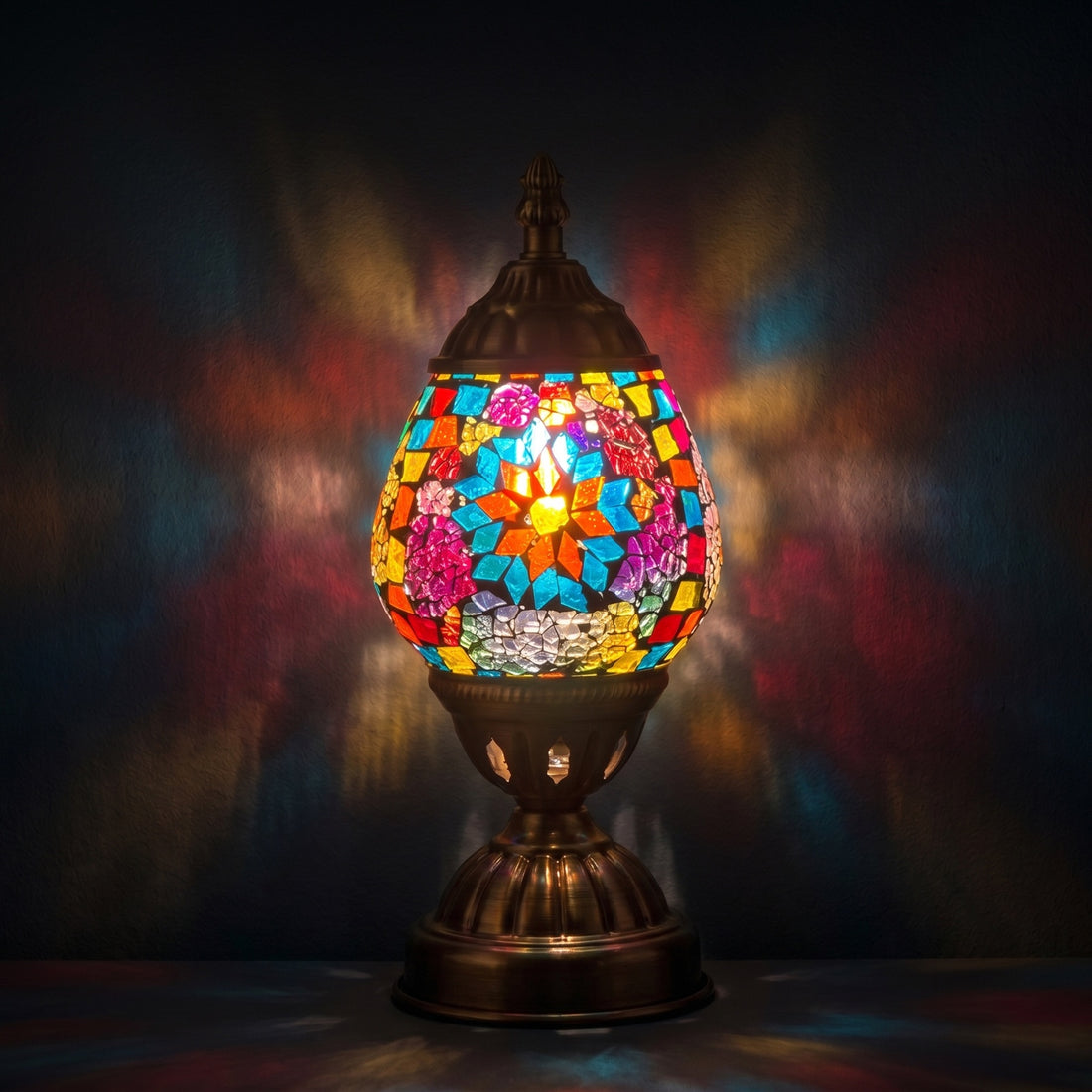 Blue Petal Mosaic Bedside Lamps mosaic glass table lamp — glowing against a deep charcoal background