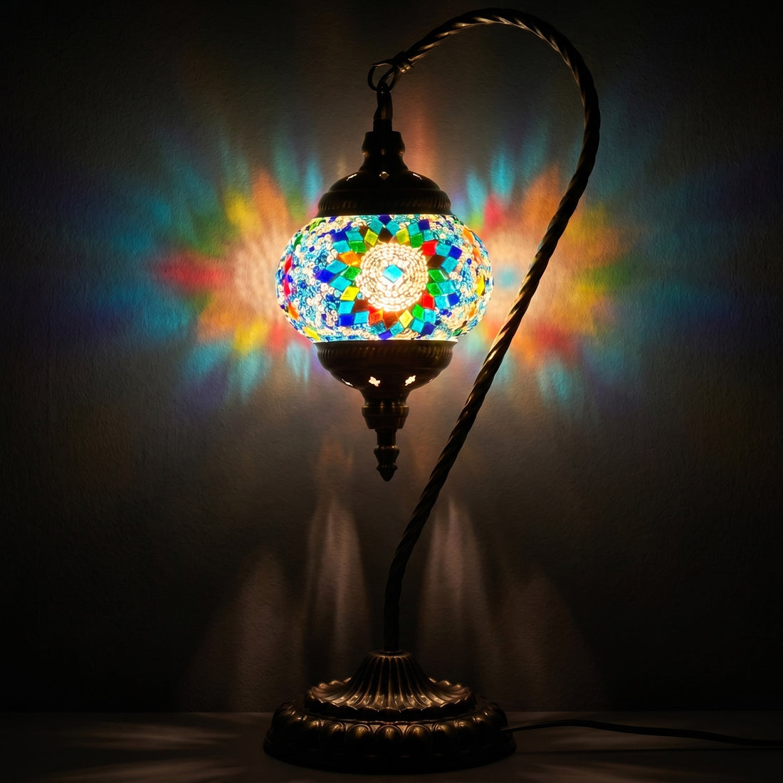 Blue Sunflower Swan Neck Mosaic Table Lamp mosaic glass table lamp — glowing against a deep charcoal background