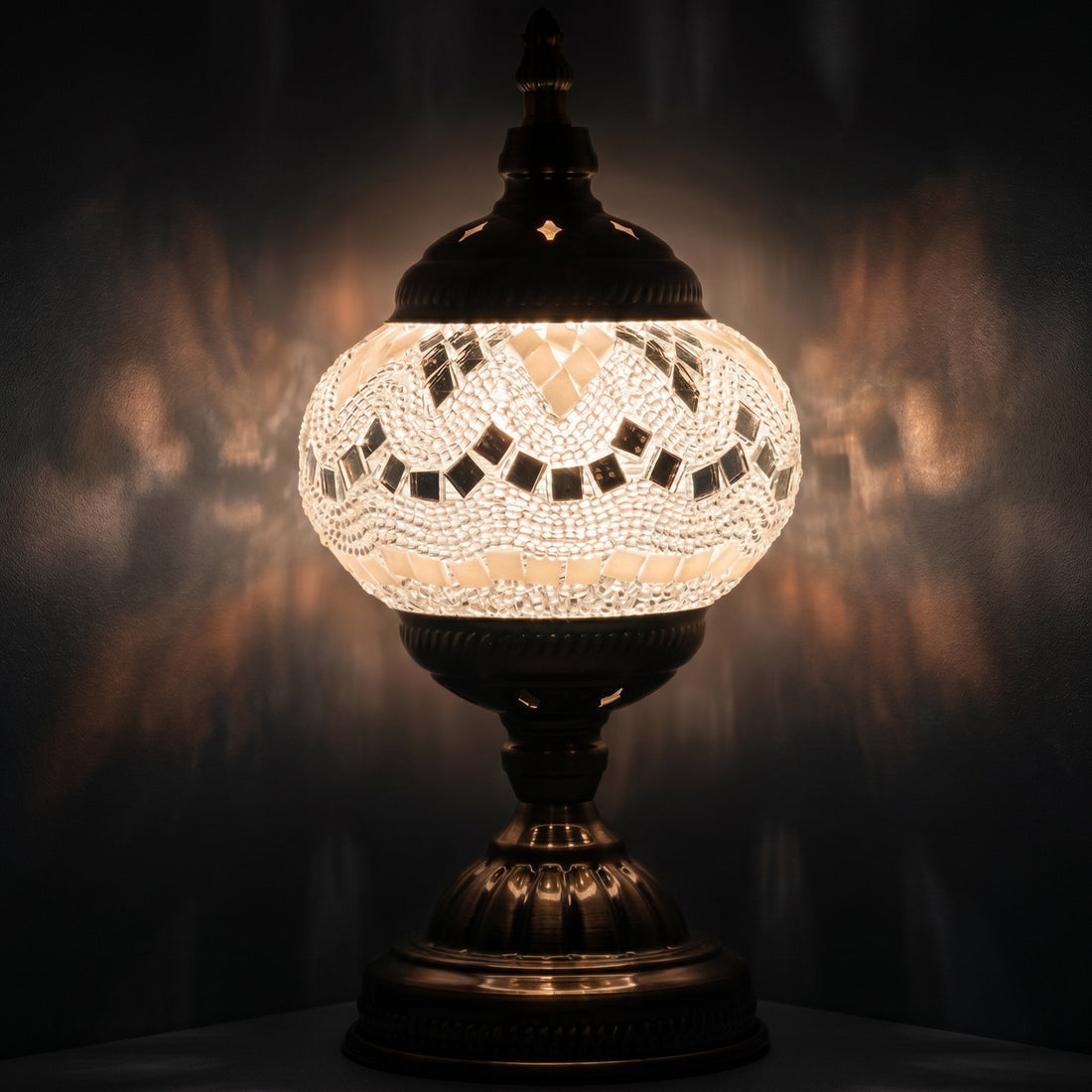 Bright Moonlight Colors mosaic glass table lamp — glowing against a deep charcoal background