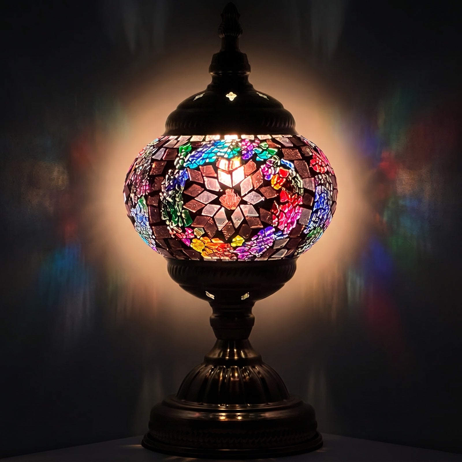 Brown Rainbow Mosaic Desk Lamps mosaic glass table lamp — glowing against a deep charcoal background