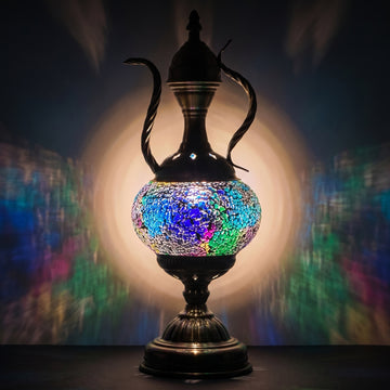 Celestial Beauty mosaic glass table lamp — glowing against a deep charcoal background