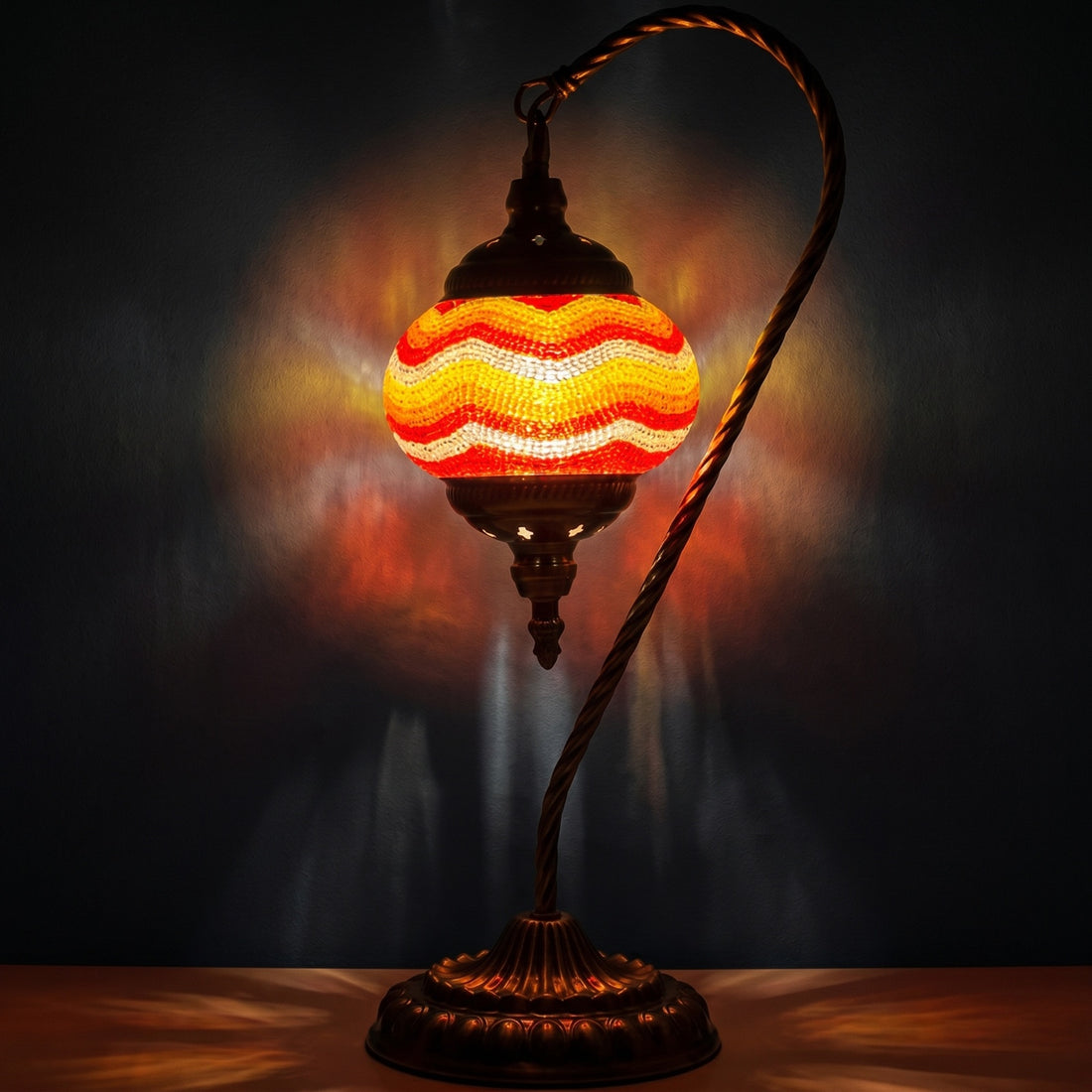 Citrus Radiance mosaic glass table lamp — glowing against a deep charcoal background