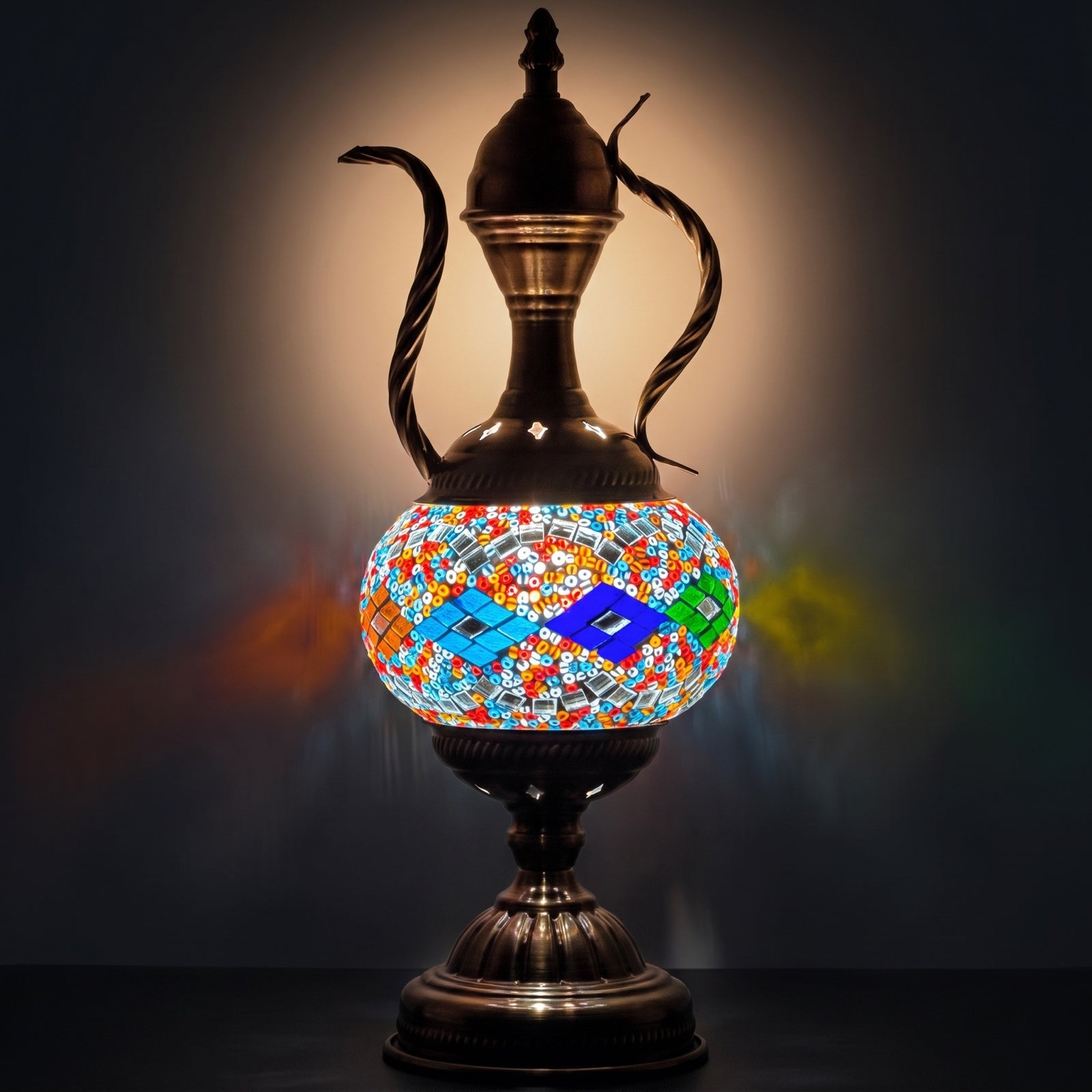 Colorful Elegance mosaic glass table lamp — glowing against a deep charcoal background