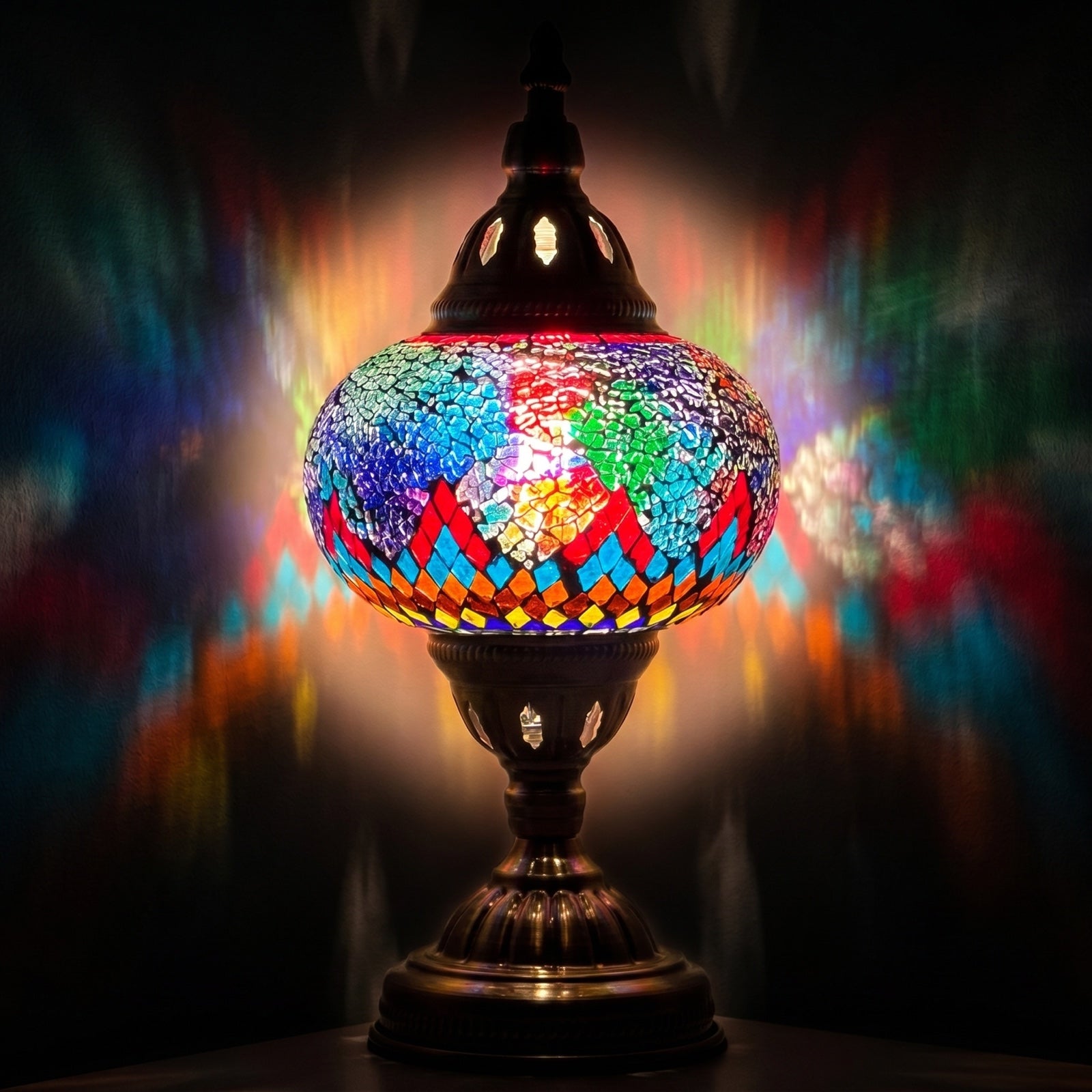 Cosmic Rainbow Bridge mosaic glass table lamp — glowing against a deep charcoal background