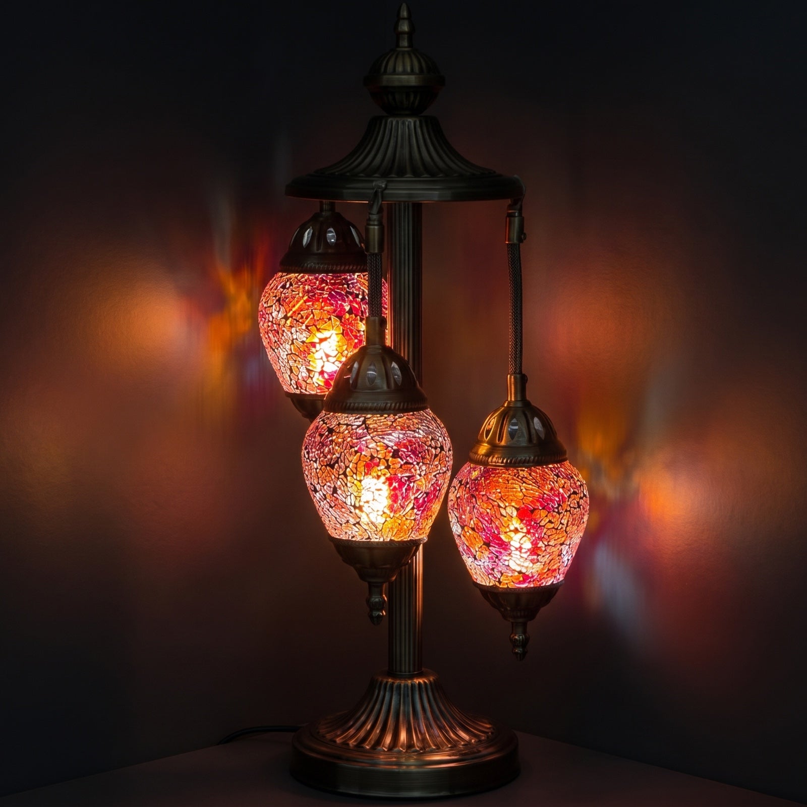 Cosmic Red Hues Egg mosaic glass table lamp — glowing against a deep charcoal background