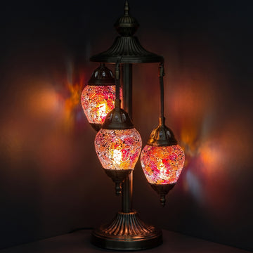 Cosmic Red Hues Egg mosaic glass table lamp — glowing against a deep charcoal background