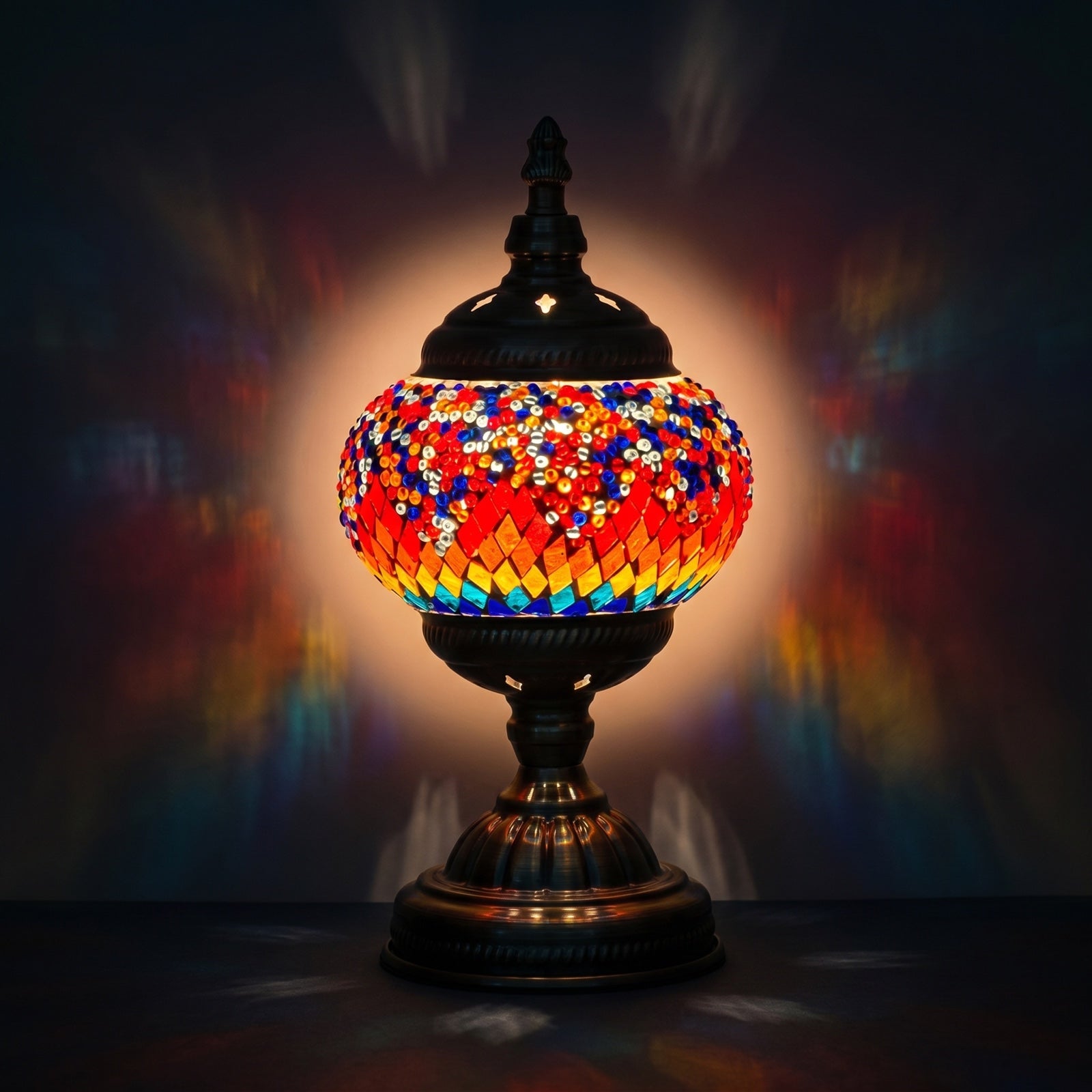 Crimson Spectrum mosaic glass table lamp — glowing against a deep charcoal background
