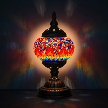 Crimson Spectrum mosaic glass table lamp — glowing against a deep charcoal background