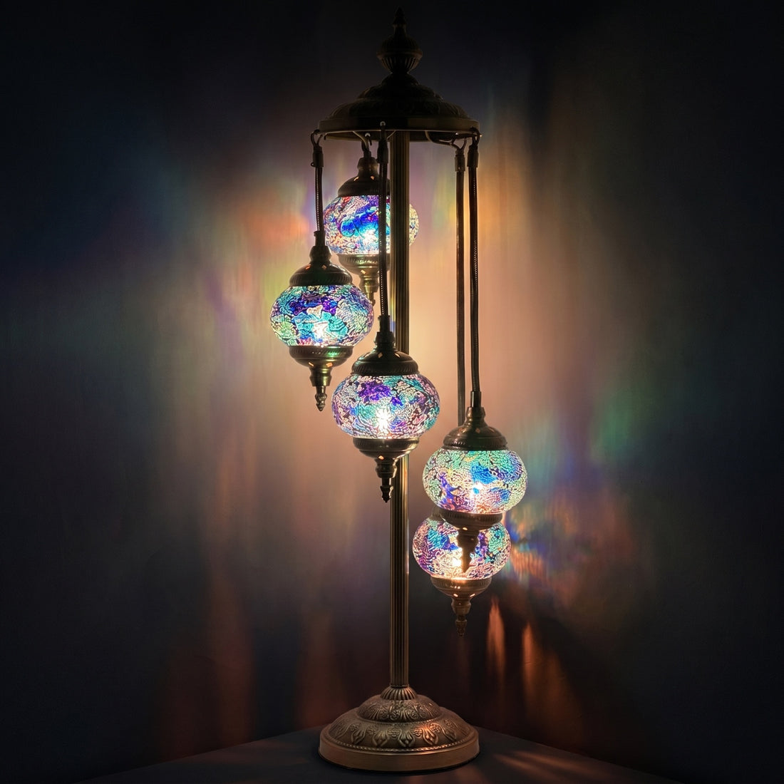 Deep Sea Blue Turkish Lamp with Quintuple Mosaic Globes mosaic glass table lamp — glowing against a deep charcoal background