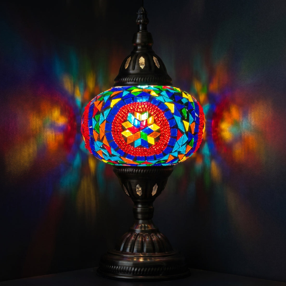 Desert Rose Blue Mosaic Desk Lamp mosaic glass table lamp — glowing against a deep charcoal background