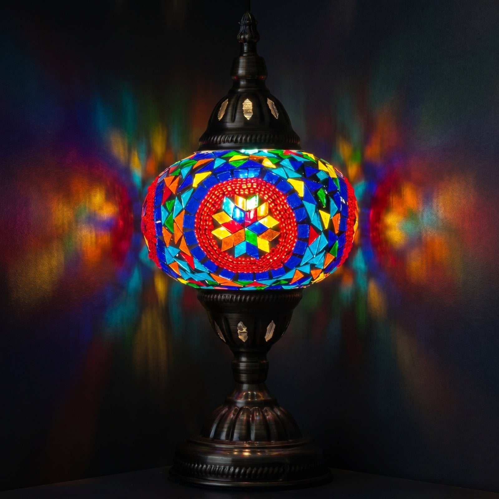 Desert Rose Blue Mosaic Desk Lamp mosaic glass table lamp — glowing against a deep charcoal background